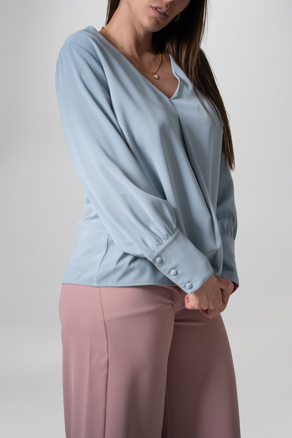 Blusa manga larga con escote en V y puños abotonados