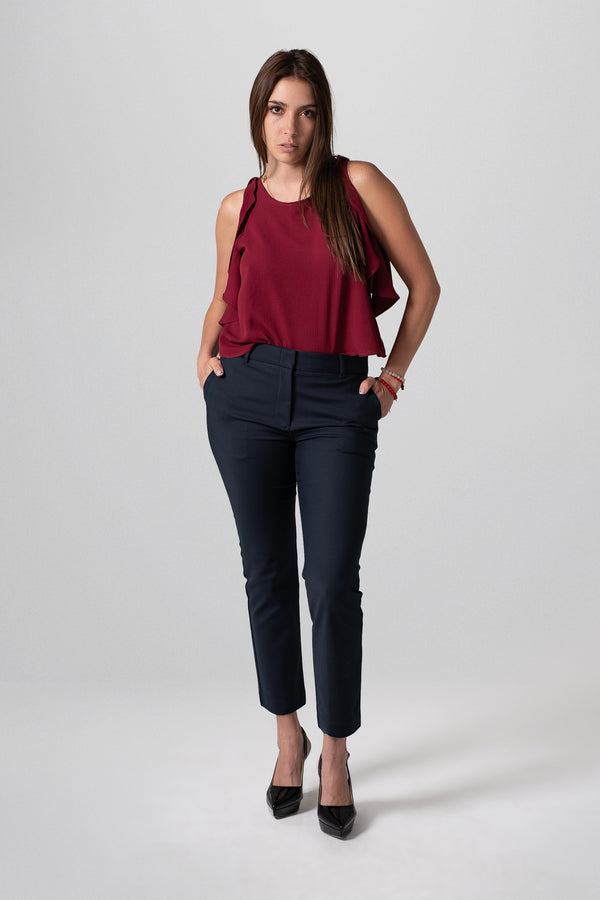 Blusa sin mangas con volantes laterales